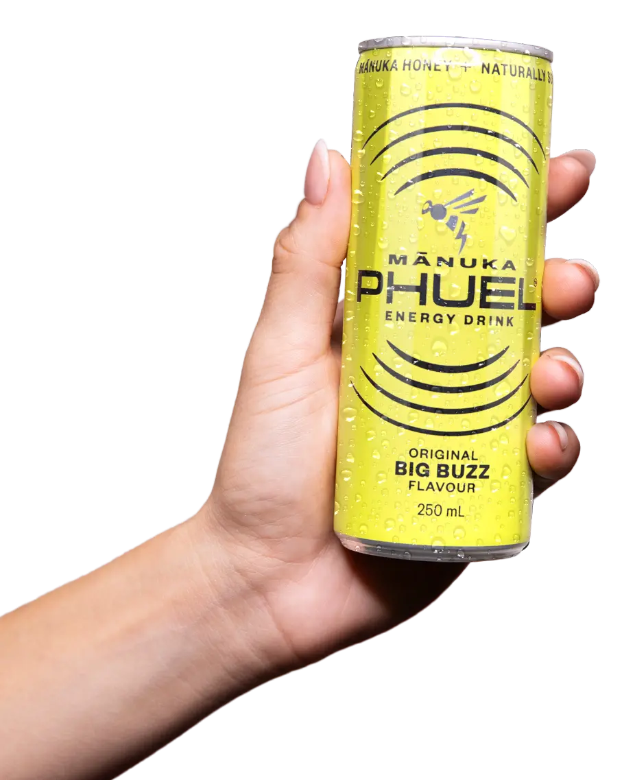 Mānuka Phuel Big Buzz yellow can in hand